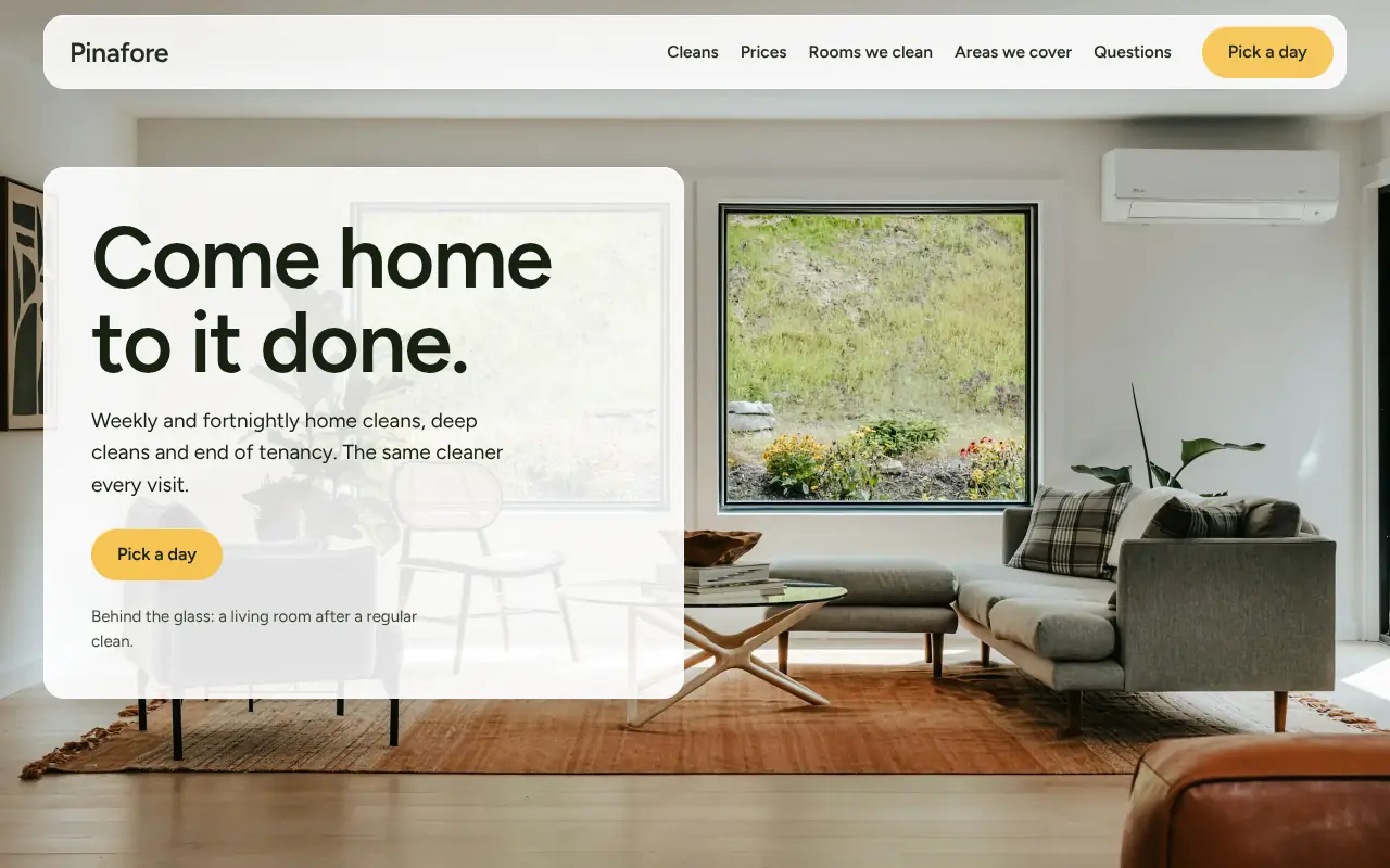 Pinafore, an invented home cleaning company: desktop home page in frosted glass over a real living room photo.